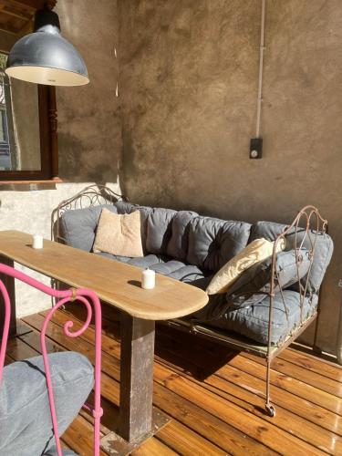 a living room with a couch and a table at Le refuge du Milan in Bertren