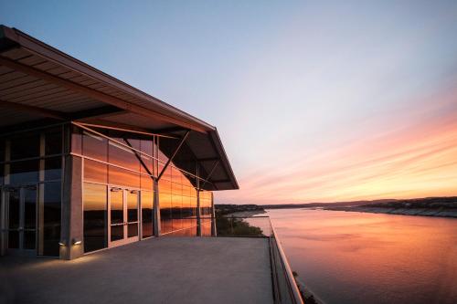 a building with a sunset in the background at Lakeway Resort & Spa in Lakeway