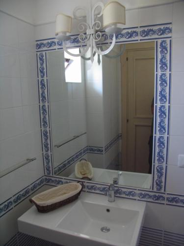 a bathroom with a sink and a mirror at Antica Tindari in Patti