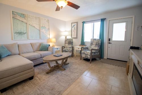 a living room with a couch and a table at Double Take! Renovated Vacation Home in Panama City Beach