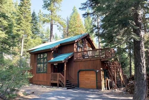a cabin in the woods with a wooden at Sunnyside Up cabin in Tahoe City