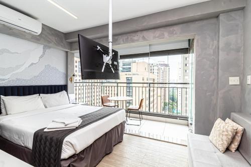 Uma cama ou camas num quarto em Studio com ótima localização em Moema