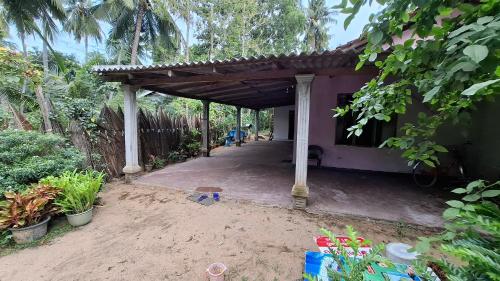 a patio of a house with a covered porch at Supipi House Panama in Panama