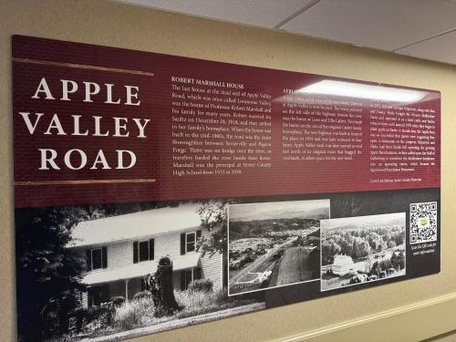 a sign on the wall of an apple valley road at The Inn at Apple Valley, an Ascend Collection Hotel in Pigeon Forge