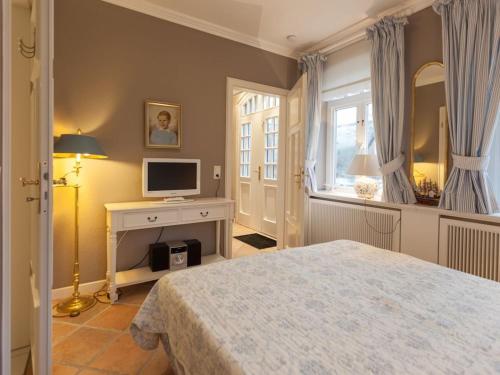 En eller flere senge i et værelse på Country house Bi Müür