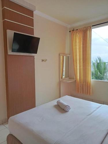 Postel nebo postele na pokoji v ubytování Hotel Dragon Palace