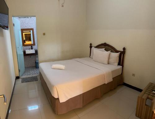 Postel nebo postele na pokoji v ubytování Hotel Dragon Palace
