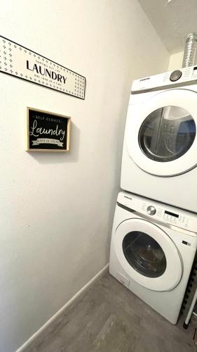 a laundry room with a washing machine and a sign at House with lake view in Port Richey