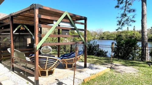 a playground with two chairs and a swing at House with lake view in Port Richey