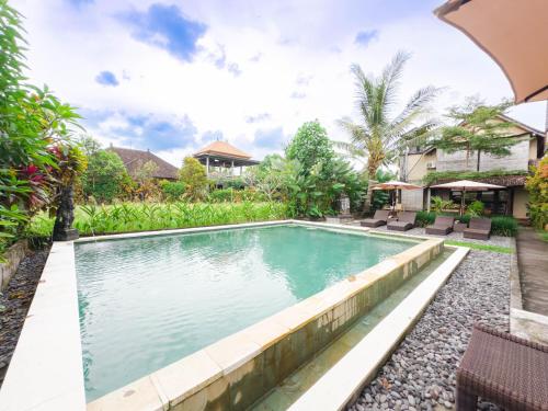 an image of a swimming pool in a house at Ubud Shanti Rice Field House By Supala in Ubud