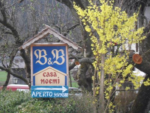 a sign for a csa morriot on a street at Casa Noemi Imer in Imer