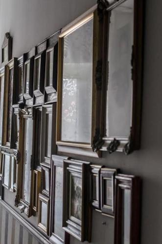 a row of windows on a wall in a room at Pastel Guesthouse in Balatonfüred