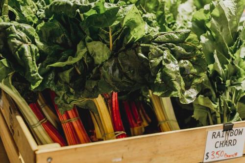 a wooden crate filled with lettuces and other vegetables at McGill Vineyard Barossa in Lights Pass