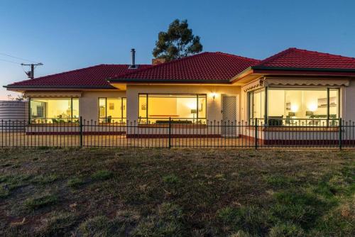 a house with a fence in front of it at McGill Vineyard Barossa in Lights Pass