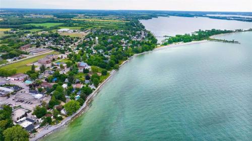an aerial view of the shore of a lake at Charming Cottage in Wellington's Heart near Beach in Wellington