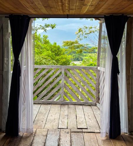 an open door to a porch with a view at Pueblo Chiquito in Inderena