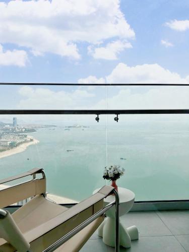 a balcony with a view of the ocean from a building at A La Carte Ha Long Oceanview Fireworksview 2BR2WC suite with balcony in Ha Long