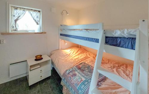 a bedroom with two bunk beds and a desk at Pet Friendly Home In Ullared With Sauna in Ullared