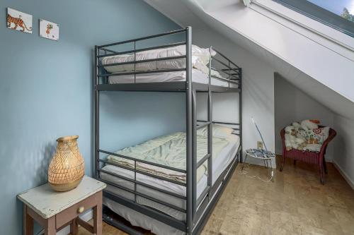 a bedroom with a bunk bed in a attic at Juliette V4 P in Oostduinkerke