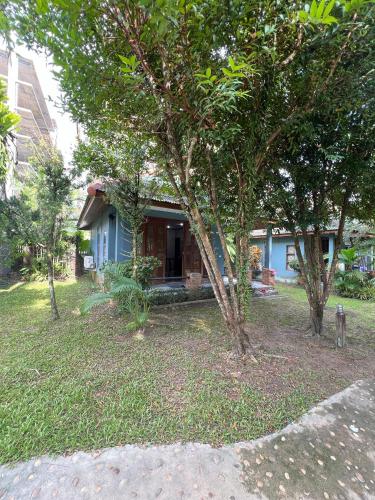 a small blue house with trees in front of it at Moubillow Resort in Ao Nang Beach