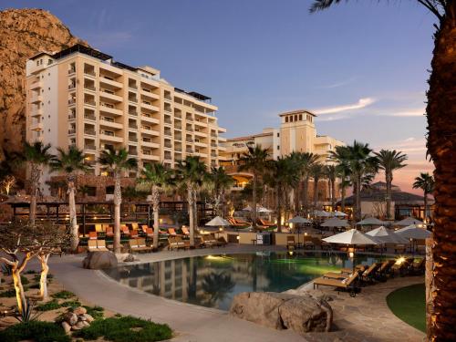 a view of a resort with a pool and palm trees at Grand Solmar Land's End Resort & Spa in Cabo San Lucas