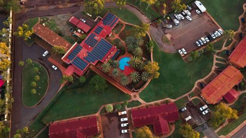 an overhead view of a yard with houses and a pool at The Lodge Motel Newman in Newman