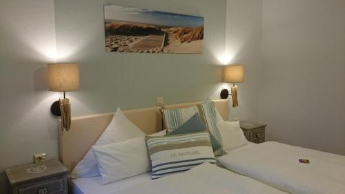 سرير أو أسرّة في غرفة في Hotel Villa Verde