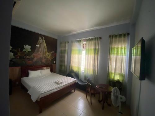 Ένα ή περισσότερα κρεβάτια σε δωμάτιο στο Sapa Hotel