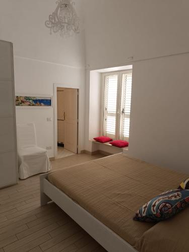 a bedroom with a large bed in a room at Love in Blue - La Terrazza di Positano in Positano