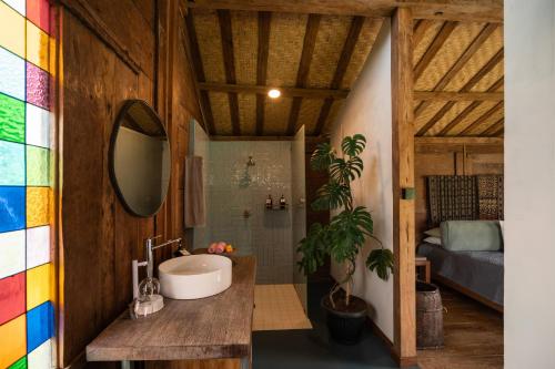 a bathroom with a sink and a shower at Desa Seni Baturiti in Baturiti