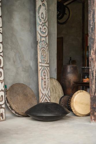 a group of plates and bowls sitting on a table at Desa Seni Baturiti in Baturiti