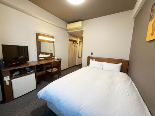 TV a/nebo společenská místnost v ubytování Hotel Route-Inn Omagari Ekimae