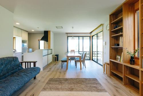 a living room with a couch and a table at フォレスト247 in Nagano