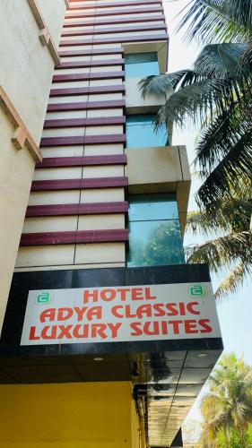 a hotel occupancy sign in front of a building at Hotel Adya Classsic in Kammasandra