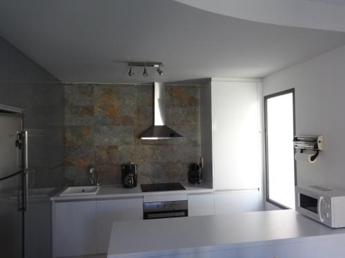 Kuchyň nebo kuchyňský kout v ubytování Residencial Sabrina Penthouse