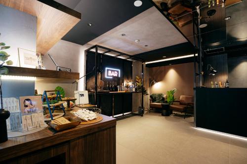a room with a bar with a sign on the wall at Hotel The Loop in Tokyo