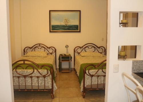 En eller flere senge i et værelse på El Patio Suites II