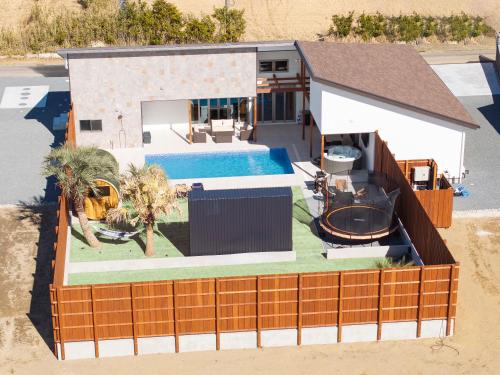 an overhead view of a house with a swimming pool at VILLA SENSE kujukuri in Kujukuri