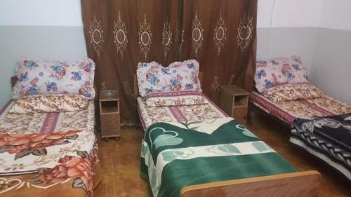 A bed or beds in a room at Sami Hostel