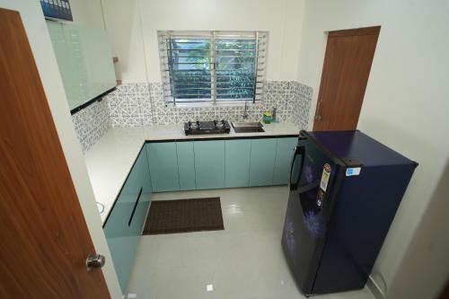 an overhead view of a kitchen with a video game at Theeram Residency in Iringal