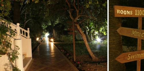 two pictures of a street at night with a sign that says roos hotel at Le Hammamet Hôtel & Spa in Hammamet