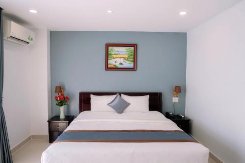 Ένα ή περισσότερα κρεβάτια σε δωμάτιο στο Song Tien Hotel