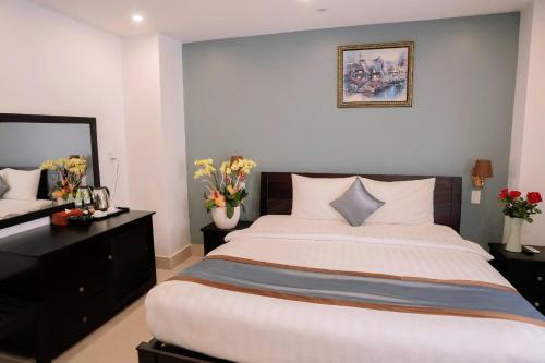 Ένα ή περισσότερα κρεβάτια σε δωμάτιο στο Song Tien Hotel