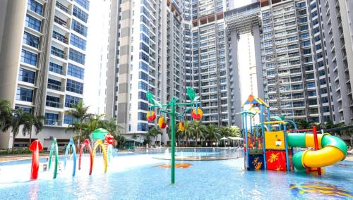 a pool of water with a water park with a playground at Atlantis Residences Melaka in Melaka