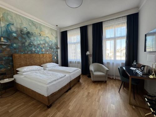 Ein Bett oder Betten in einem Zimmer der Unterkunft Hotel Secession an der Oper
