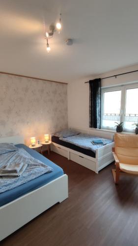 Postel nebo postele na pokoji v ubytování Ferienwohnung im Moselland
