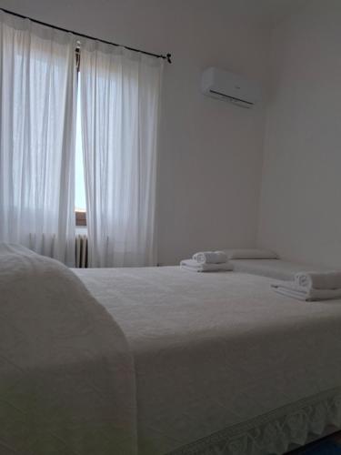 Postel nebo postele na pokoji v ubytování Hotel Moderno