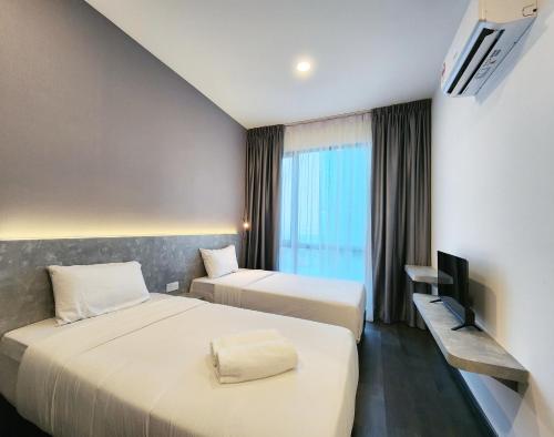Ένα ή περισσότερα κρεβάτια σε δωμάτιο στο SKS Pavillion Suites