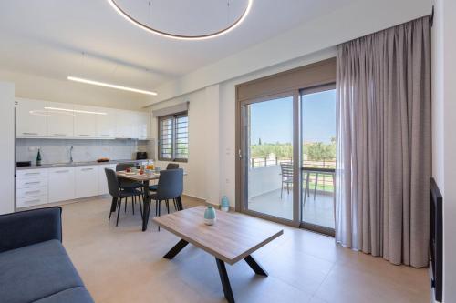 a living room with a couch and a table at Azari Lifetime Memories in Paralion astros