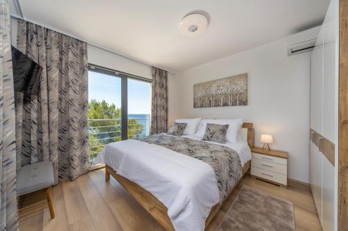 Posteľ alebo postele v izbe v ubytovaní Villa Poseidon
